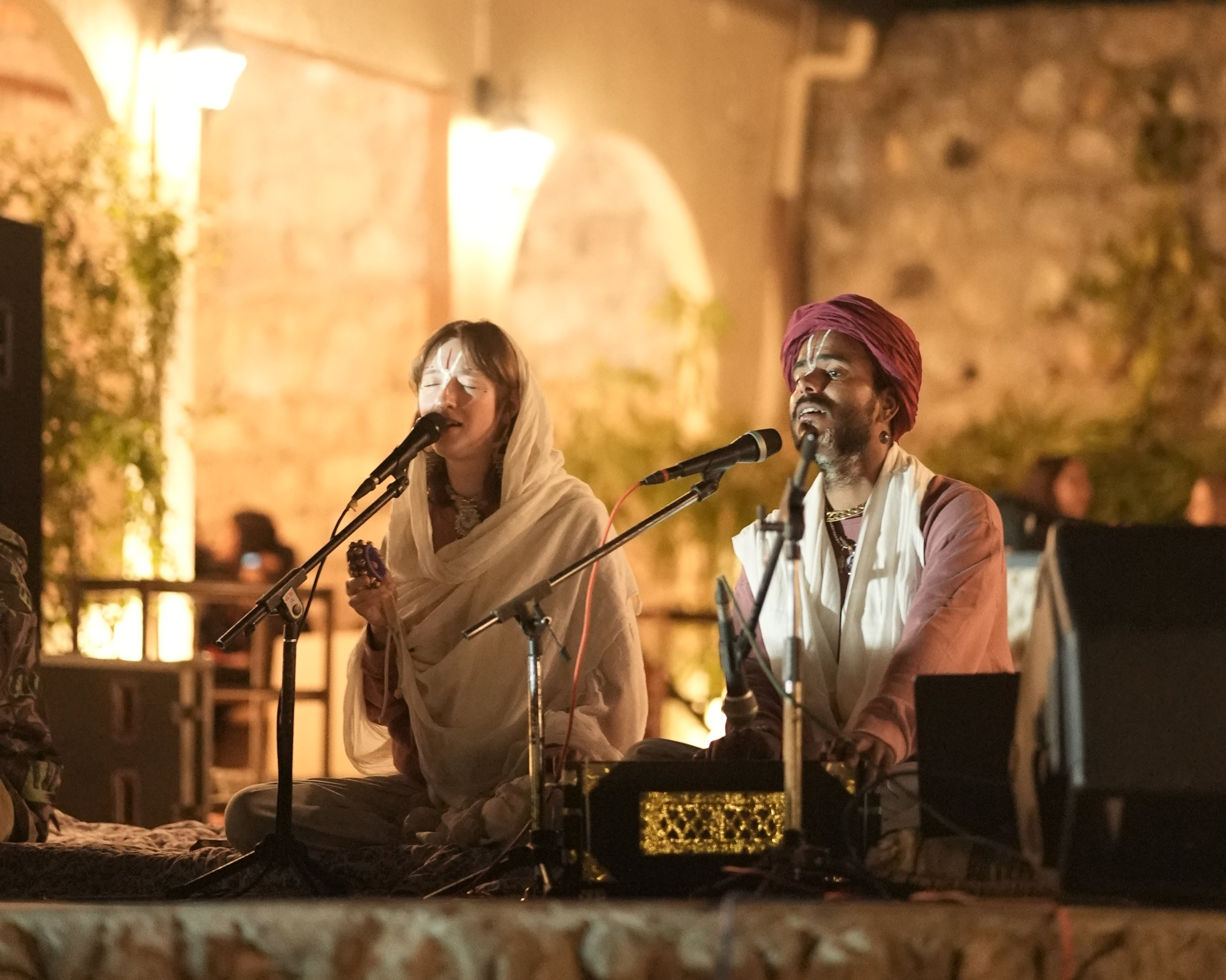 Prem and Ananda singing and playing harmonium